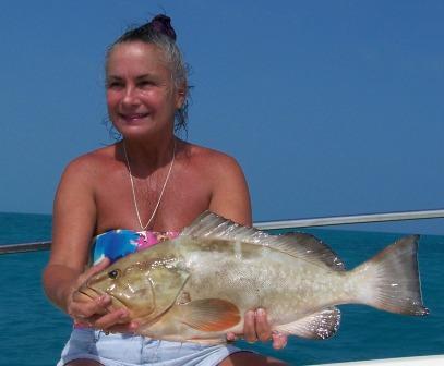 Gigi Harrison with a red grouper caught with SeaSquared Charters during the Florida Keys Grouper Tournament on May 1